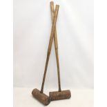 A pair of early 20th century croquet clubs. 91.5cm
