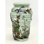 An early 20th century Chinese Celadon glazed pottery vase. With under stamp. 21cm.