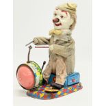 A vintage Alps tin plate mechanical clown drummer. Made in Japan. 11x20x24cm