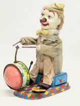 A vintage Alps tin plate mechanical clown drummer. Made in Japan. 11x20x24cm