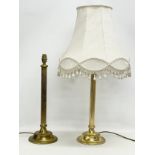 A pair of tall vintage brass table lamps. 17x51cm