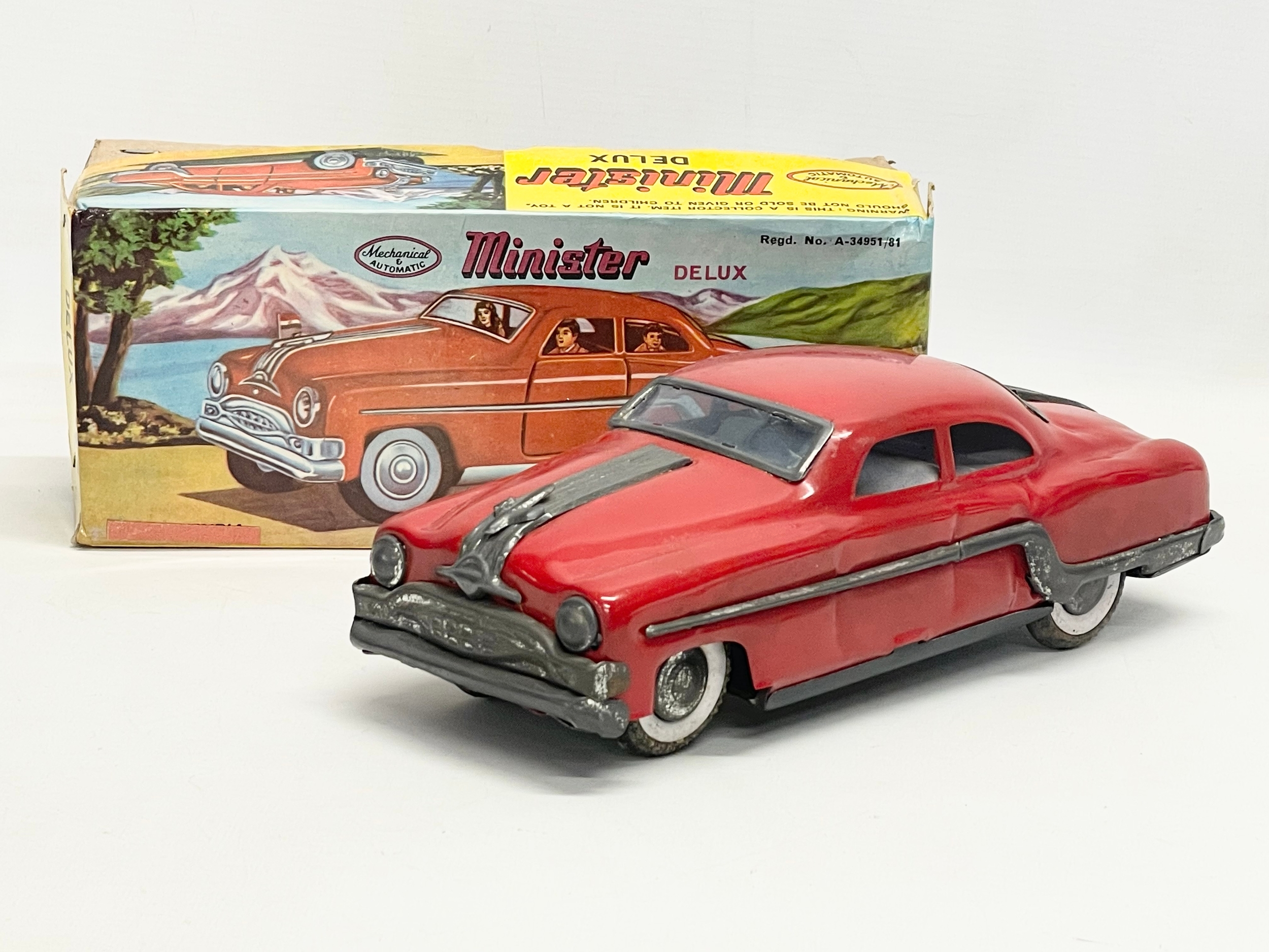 A vintage tin plate Mechanical & Automatic ‘Minister Delux’ collectors Pontiac car in original