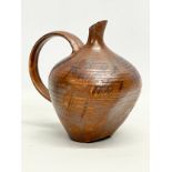 An unusual glazed pottery jug in the manner of Kurt Tschörner Ruscha. 14x14cm