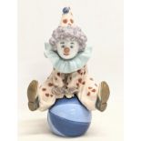 A signed Lladro pottery figure, 'Having a Ball.' 18cm