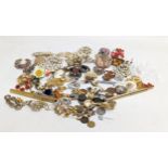 A collection of vintage brooches, pins, earrings, etc.