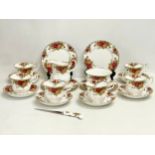 A 21 piece Royal Albert Old Country Roses tea set. 6 sandwich plates, a knife, 6 cups, 6 saucers,