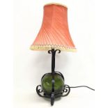 A vintage wrought iron table lamp. 51cm