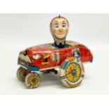 A vintage tin plate ‘Crazy Cop’ windup toy. Made in Great Britain 16x14cm