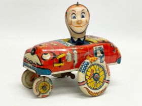 A vintage tin plate ‘Crazy Cop’ windup toy. Made in Great Britain 16x14cm