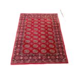 A vintage Middle Eastern style rug. 240x169cm