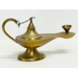 An early 20th century Middle Eastern Aladdin brass lamp. 21cm
