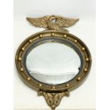 A vintage Regency style gilt framed convex mirror. 48x71cm