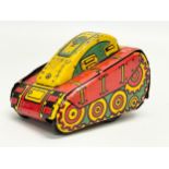 A vintage Marx tin plate windup flip over tank. 10cm