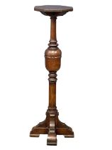 A large early 20th century heavy oak torchiere. 1920. 45x131cm