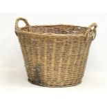 A large vintage heavy wicker basket. 55x51x40cm