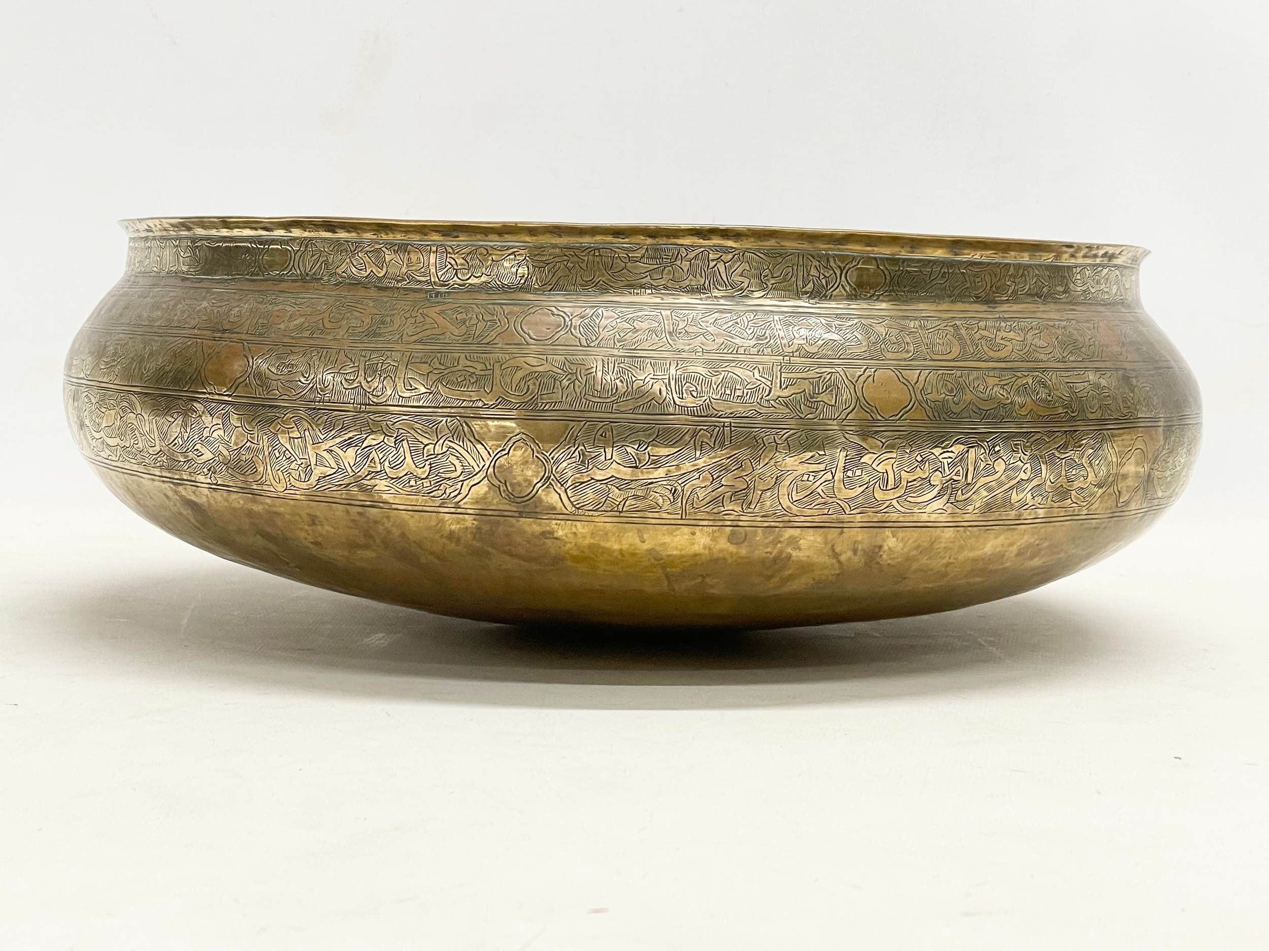 A large 19th century Middle Eastern brass bowl with a late 19th/early 20th century brass vase. - Image 9 of 13