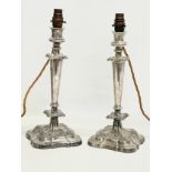 A pair of large good quality late Victorian silver plated table lamps. Converted from