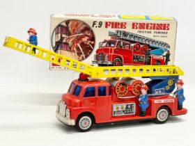 A vintage tinplate Kokyu friction powered F.9 Fire Engine in original box. Made in Japan. Fire