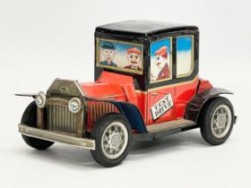A vintage tinplate Daiya friction drive ‘Test Drive Antique Car’ made in Japan. 17x10cm
