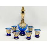 A vintage 7 piece Venetian cobalt blue hand painted drinks set. Decanter measures 25.5cm. Glasses