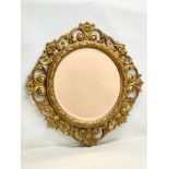 A large vintage ornate gilt framed mirror 86x87cm