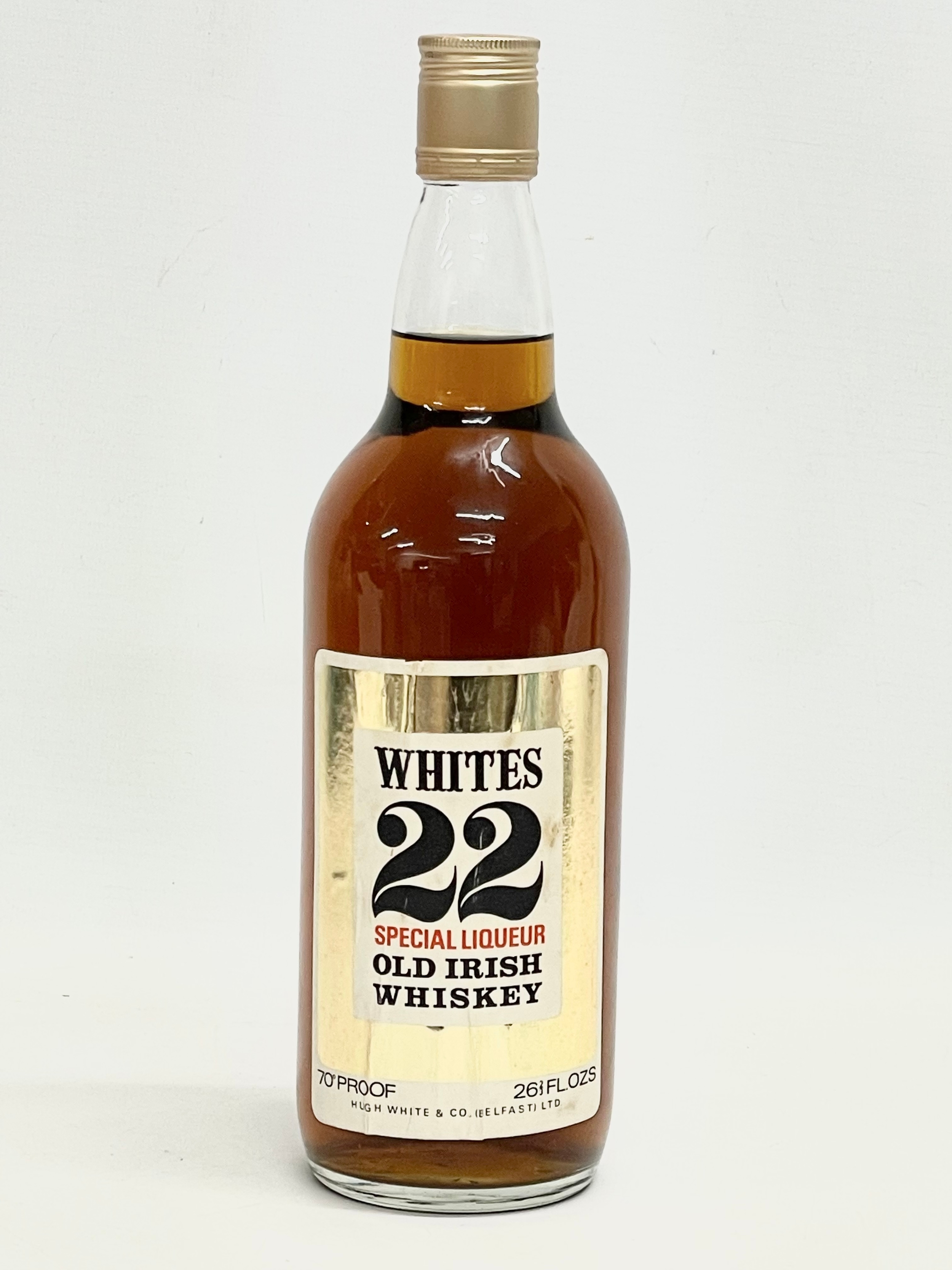 A vintage bottle of Whites 22 Special Liqueur Old Irish Whiskey. 28.5cm