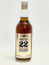 A vintage bottle of Whites 22 Special Liqueur Old Irish Whiskey. 28.5cm