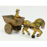 A vintage Marx tin plate windup horse and cart. 25cm
