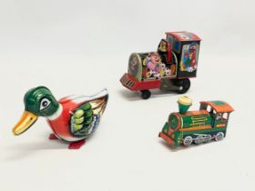3 vintage tinplate toys. A Japanese Circus Loco Train. A West German Duck. A Mettoy M816 Train.