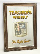 A large vintage Teachers Whisky advertising mirror. The Right Spirit. 68x93cm