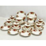 A 30 piece Royal Albert Old Country Roses tea set. 12 sandwich plates, 10 saucers and 6 cups.