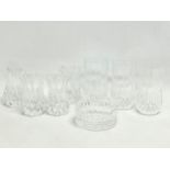 A collection of crystal. 4 matching vases 8cm. 3 matching vases 10cm. Ashtray 8.5cm