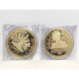 2 large commemorative coins of Queen Elizabeth II.