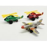 3 vintage Japanese tinplate toys. A U.S Air Force plane, an Army Helicopter and an Emergency