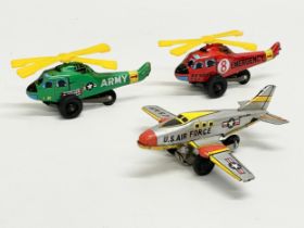 3 vintage Japanese tinplate toys. A U.S Air Force plane, an Army Helicopter and an Emergency
