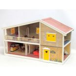 A vintage Barton Toys dolls house, 'Caroline's Home.' 69x29x40cm