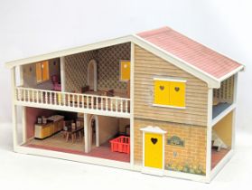 A vintage Barton Toys dolls house, 'Caroline's Home.' 69x29x40cm