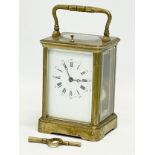 A good quality late 19th century Kands brass carriage clock with key. France. 9.5x8.5x18cm including