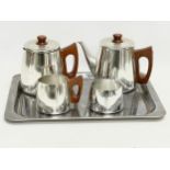 A 5 piece Mid Century stainless steel and teak tea and coffee service. By Sona. Tray measures