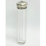 A vanity bottle with sterling silver lid. Birmingham. 16.5cm