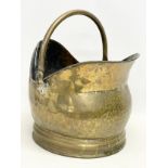 A large early 20th century brass coal scuttle. 29x39x40cm including handle.