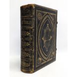 A Mid to Late 19th century ornate brass bound Brown's Self-Interpretating Family Bible. 27x34cm