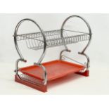 A Mid Century chrome and plastic plate rack. 43x25x38cm