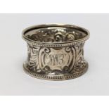 An ornate silver napkin ring, Birmingham 1881, 15.47g