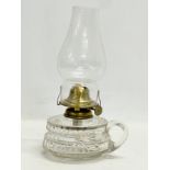 A Victorian glass finger lamp. 25cm