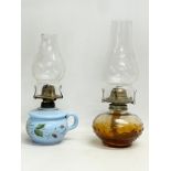 A Victorian pottery finger lamp and an Amber Glass oil lamp. 31cm
