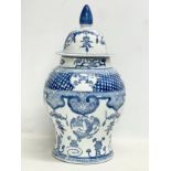 A large Chinese style blue and white porcelain jar with lid. 45cm