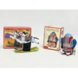 2 tinplate windup toys in original boxes. A Schylling Mechanical Rocking Cowboy 13x10cm. A