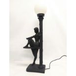 A large figurine table lamp with glass shade. 79cm