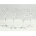 A set of 4 tall crystal champagne glasses. 20.5cm